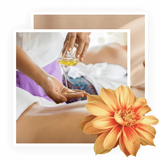 One hand pouring oil from a cup into another hand over someone's bare back who is about to get a massage. A big orange flower is super imposed over the image in the right bottom corner.