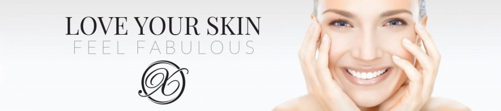 Woman smiling and touching her cheeks with text that says "love your skin feel fabulous".
