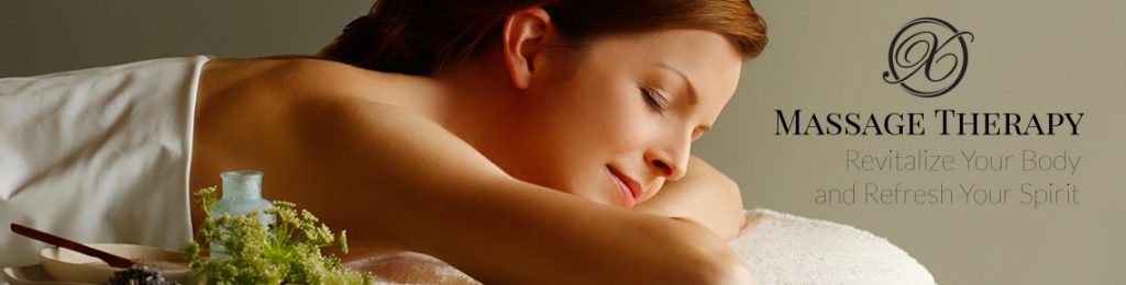 tranquil looking woman laying on a massage table with the text "massage therapy revitalize your body and refresh your spirit".
