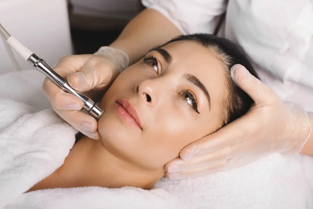Woman getting a microdermabrasion facial treatment